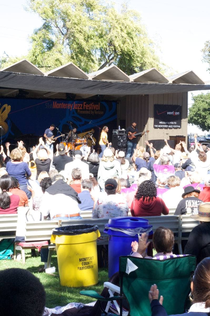 A crowd at an outdoor stage at the Monterey fairgrounds