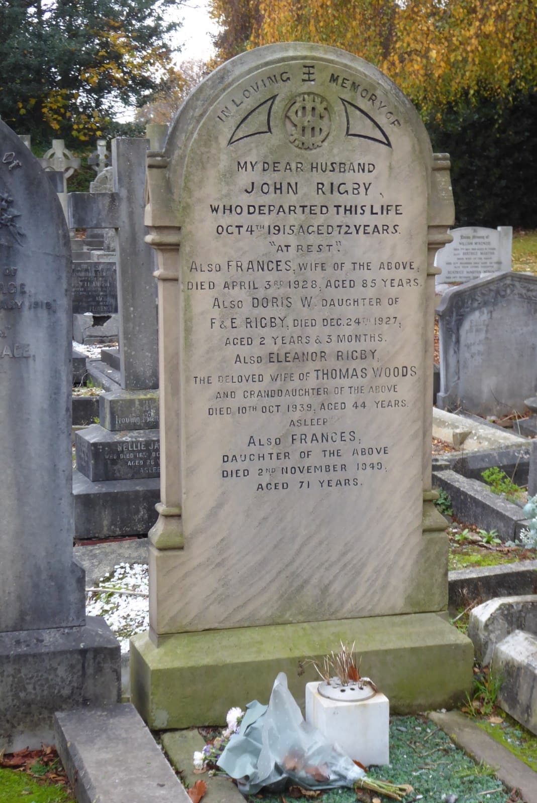 A weathered headstone in a churchyard