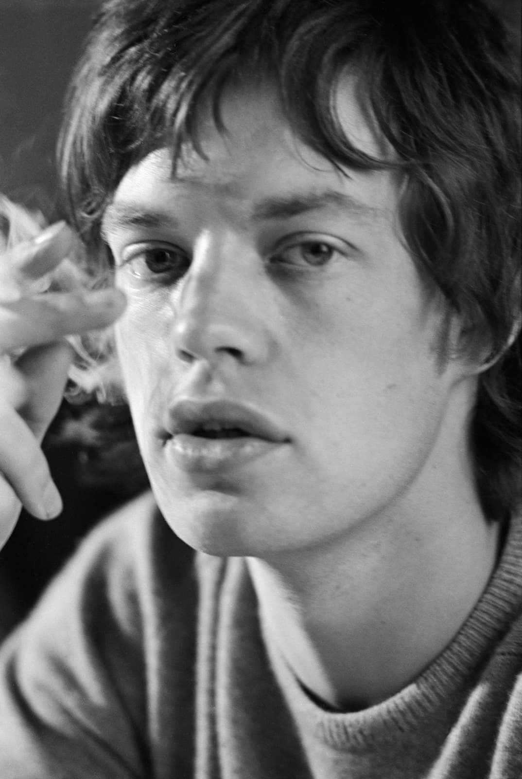 Mick Jagger in 1965, close up, hair over his forehead