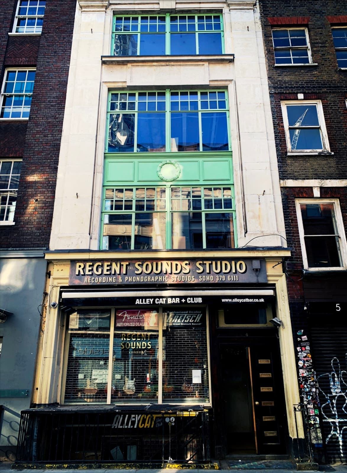 A narrow shopfront with Regent Sounds Studio over the window
