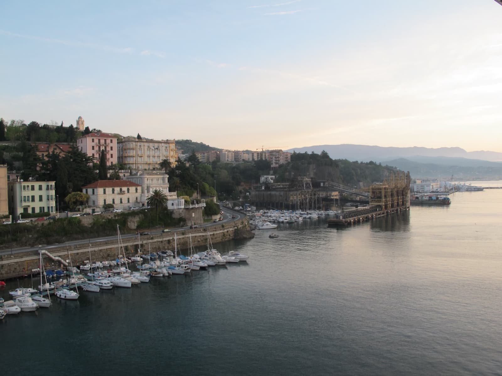 Boats in the harbour at Villefranche-sur-Mer with hills behind