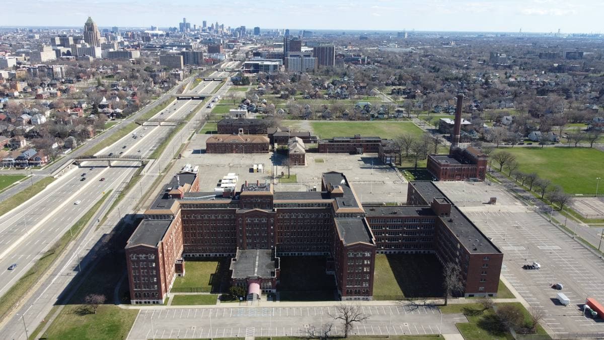 A large brick hospital building on a quiet Detroit street