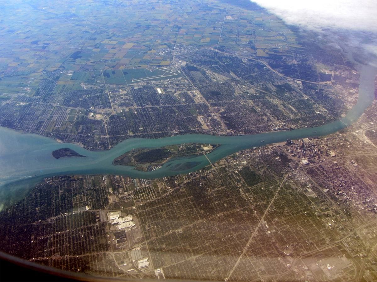 Aerial view of the Detroit River, Belle Isle and the city grid
