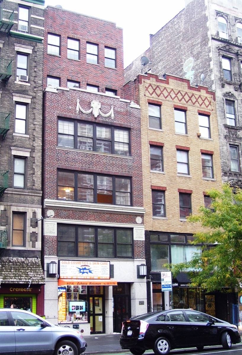 A brick apartment building on an East Village avenue