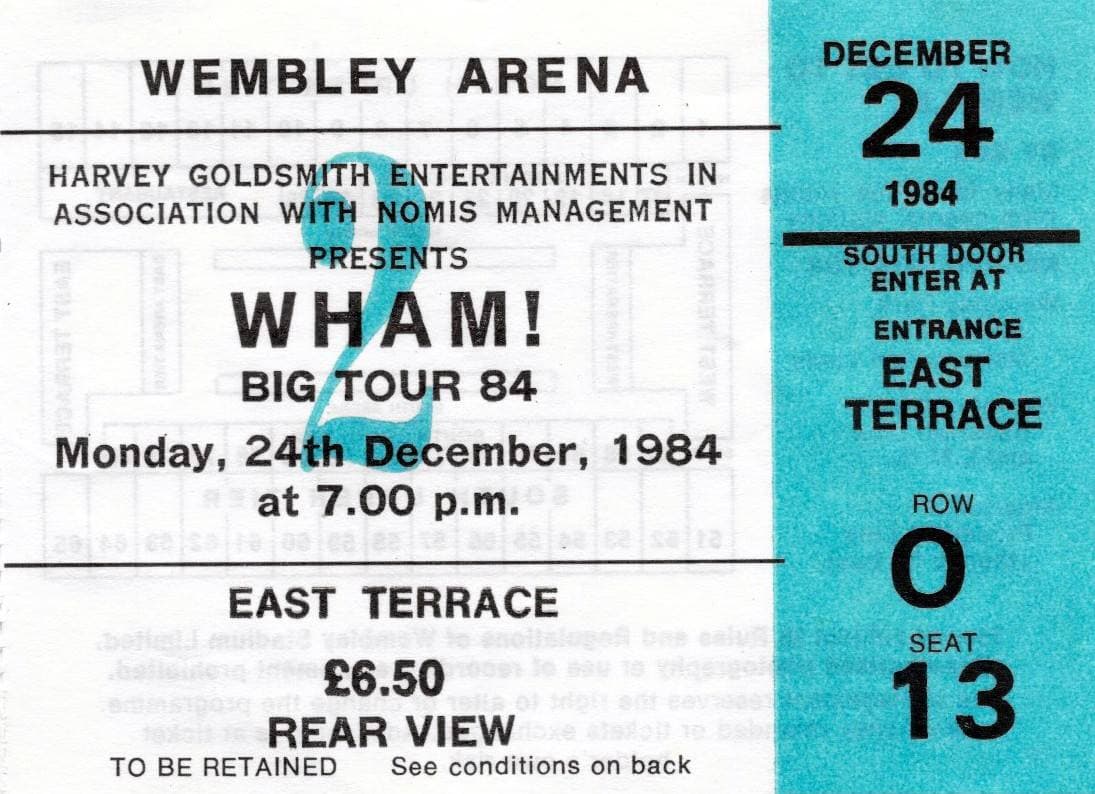 A printed concert ticket with a turquoise stub: Wembley Arena, Wham! Big Tour 84, Monday 24th December 1984, East Terrace, £6.50, row O seat 13