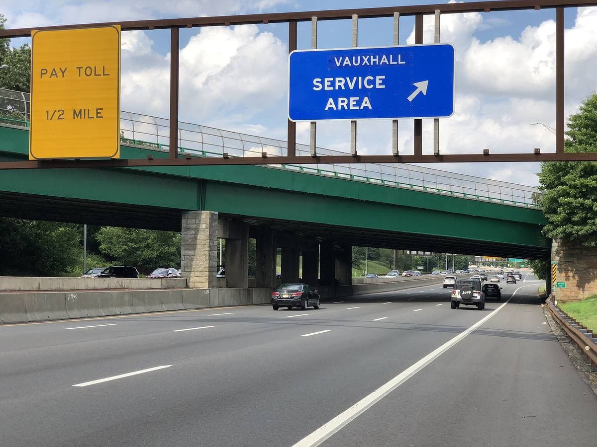 A blue overhead sign for the Vauxhall Service Area above the lanes of the Garden State Parkway