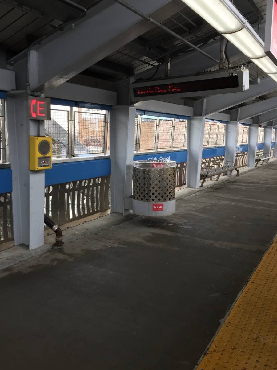 An elevated rail station on steel columns above a West Philadelphia street