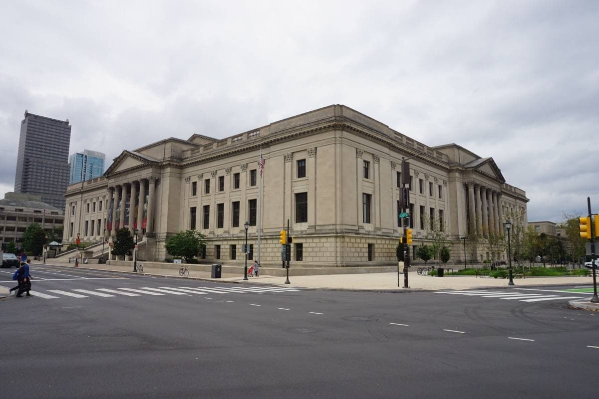 A broad classical museum front with tall columns and wide steps