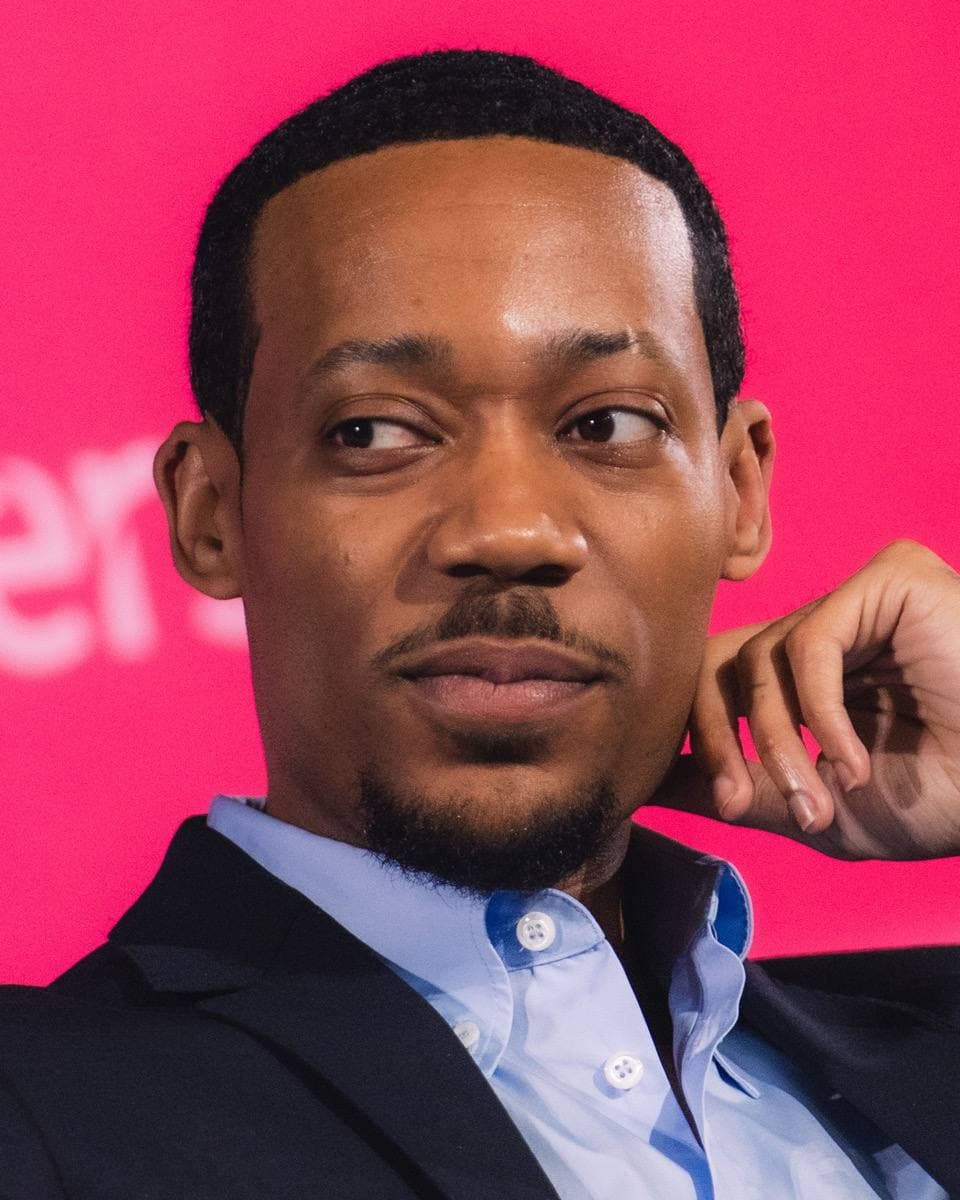 Tyler James Williams in a dark jacket at an industry event