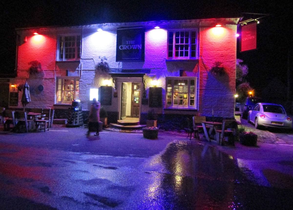 A white-painted village inn on a square
