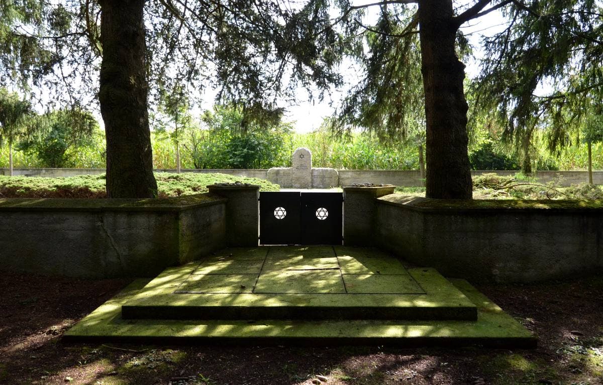 A low walled cemetery enclosure on open heath