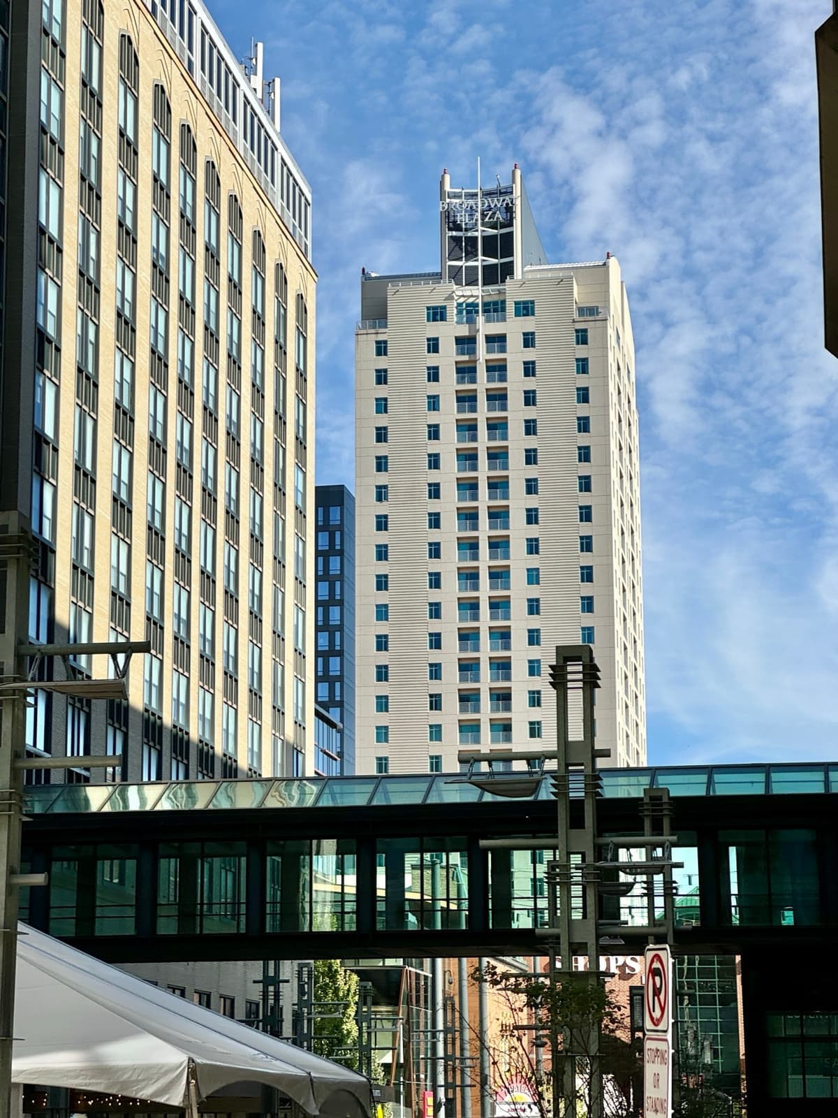 Tall buildings and a skyway over Broadway in Rochester