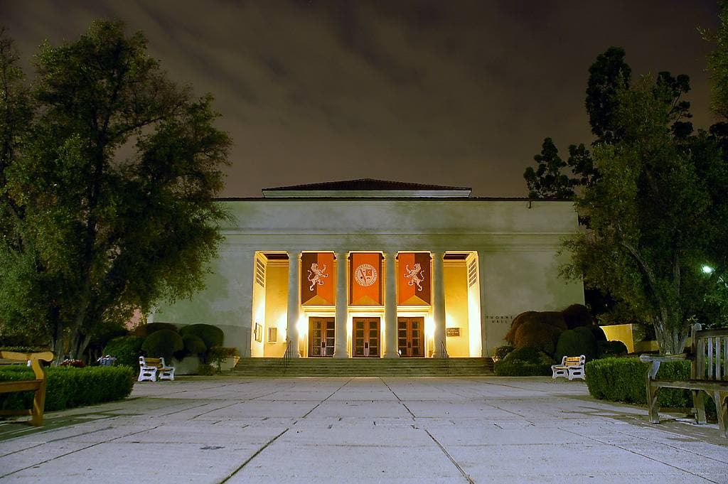 A columned college auditorium with a wide flight of steps