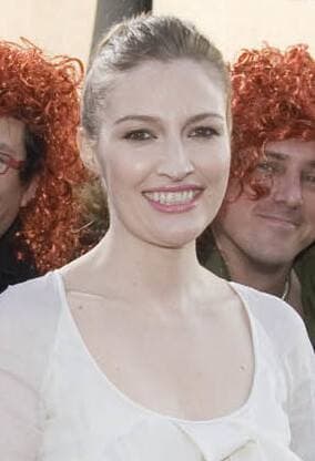 Kelly Macdonald smiling, her hair pinned up