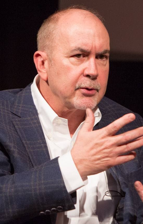 Terence Winter speaking, one hand raised