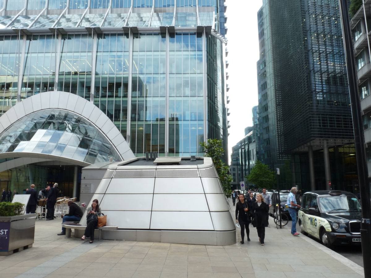 A paved plaza at the foot of an office tower on Ropemaker Street
