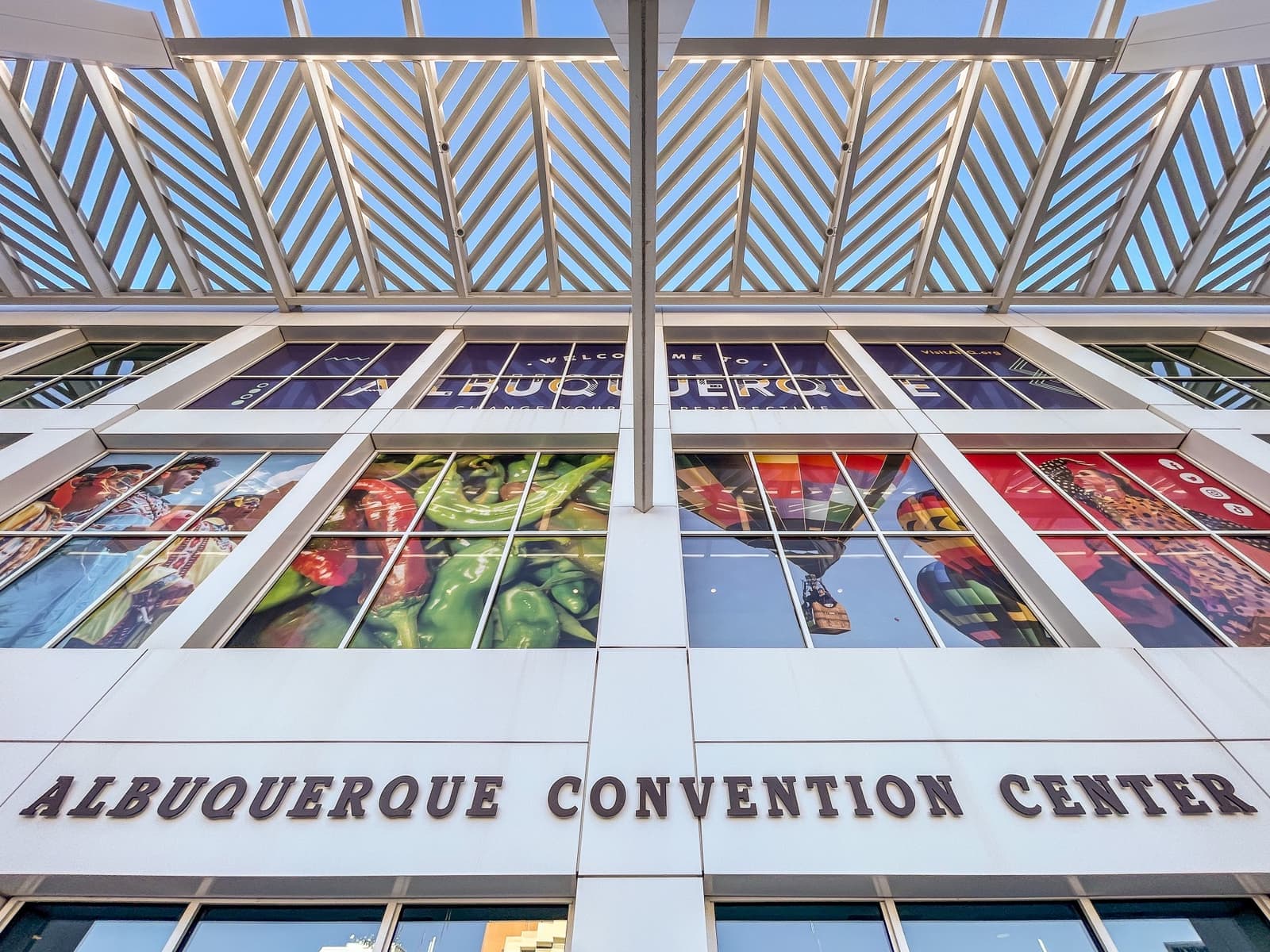 The glazed front of the Albuquerque Convention Center with its name over the doors