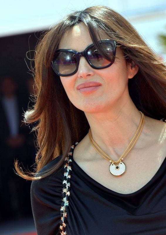 Monica Bellucci in sunglasses and a gold pendant