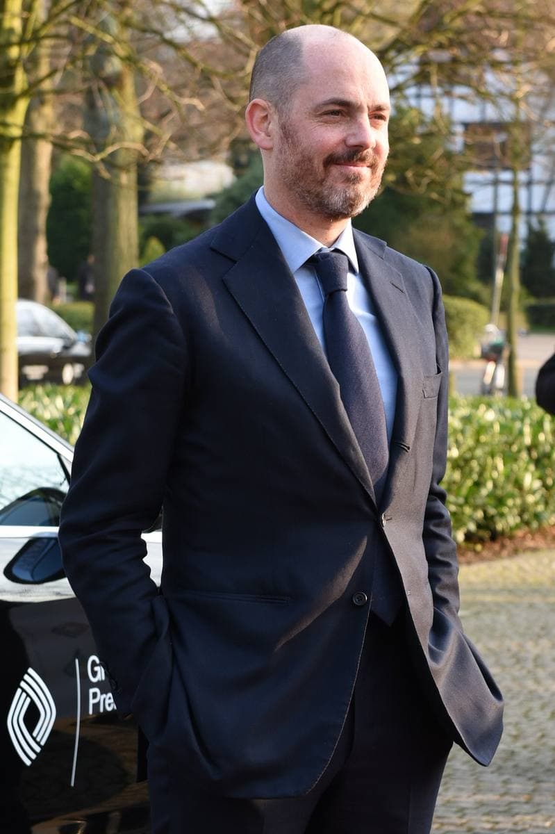 Edward Berger in a dark suit, outdoors