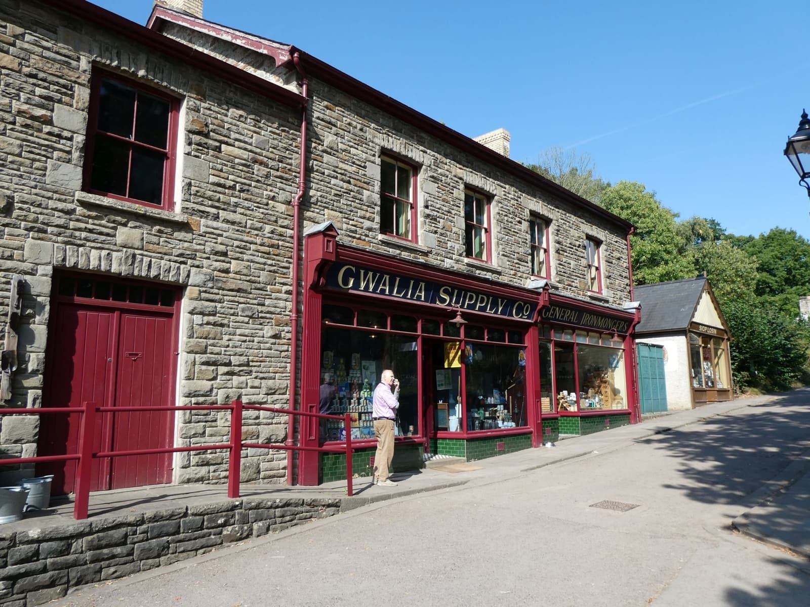 A stone shopfront painted Gwalia Supply Co. at St Fagans