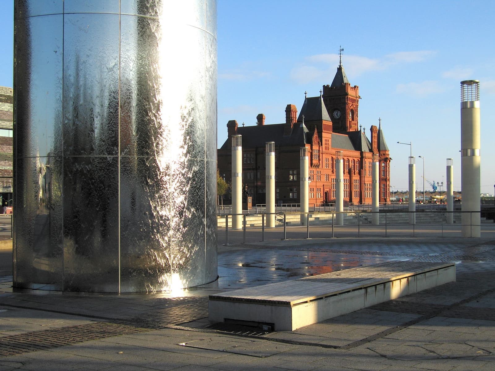 The steel Water Tower in Roald Dahl Plass with the red-brick Pierhead behind