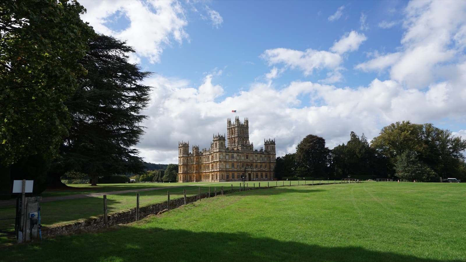 Highclere Castle’s pale stone towers across open parkland