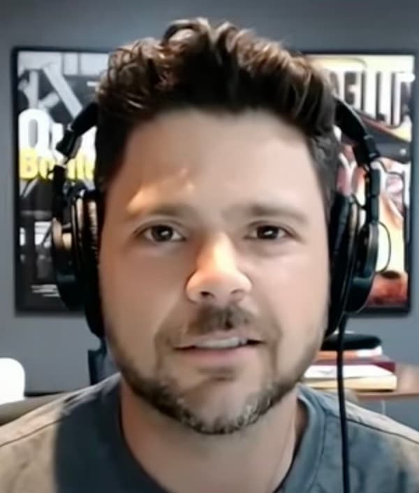 Jerry Ferrara with headphones, smiling slightly