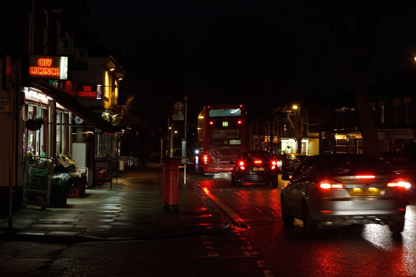A suburban high street of shops and houses in Hampton
