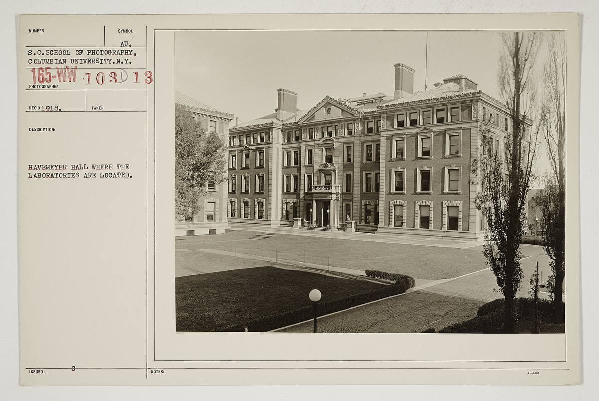 A large classical brick and stone university building with columns