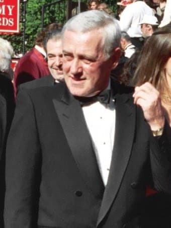 John Mahoney in black tie, grey hair, on the Emmys red carpet