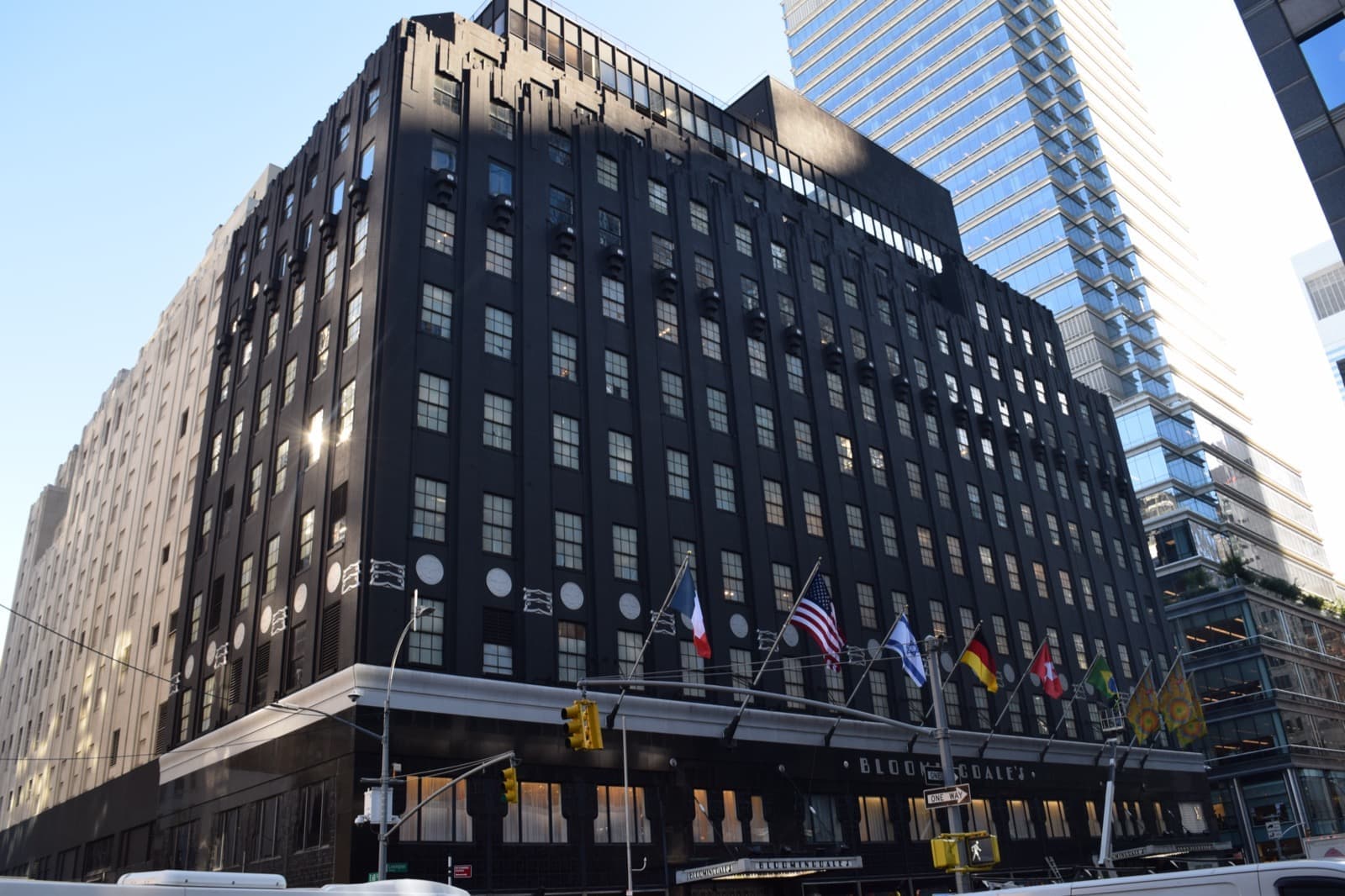 The stone and glass corner of a large department store on a Manhattan avenue
