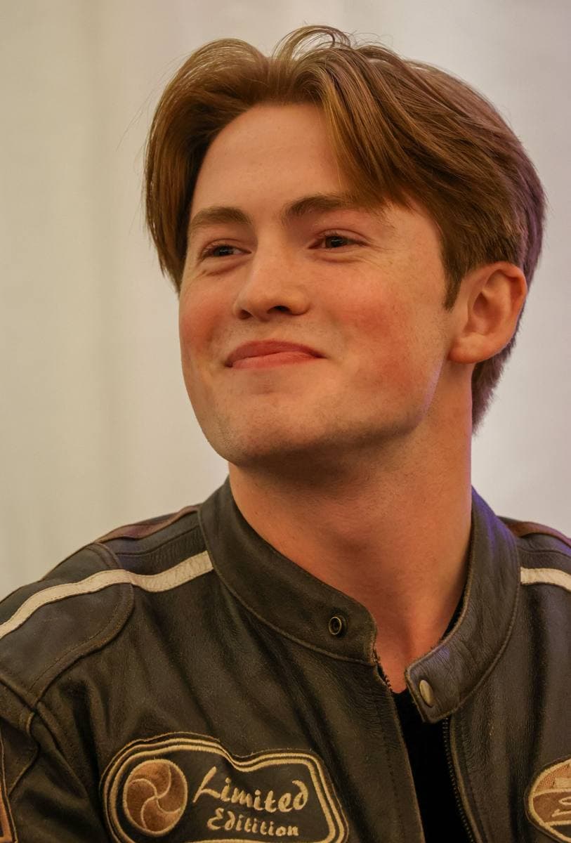 Kit Connor, a young man with short brown hair, smiling