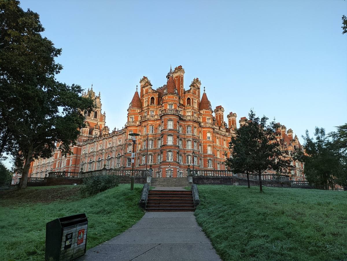 A red-brick French château-style building with turrets