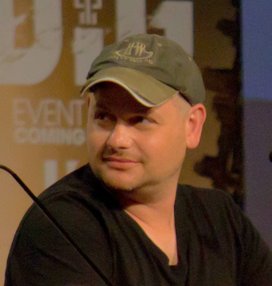Gideon Raff, dark hair and beard, speaking at a panel