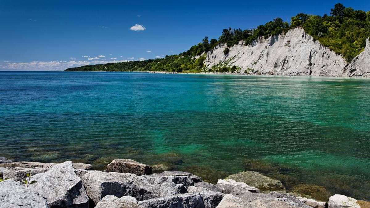 White cliffs above clear green water