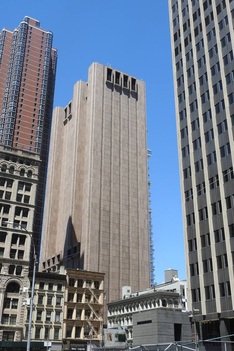 A windowless grey granite tower rising over Tribeca