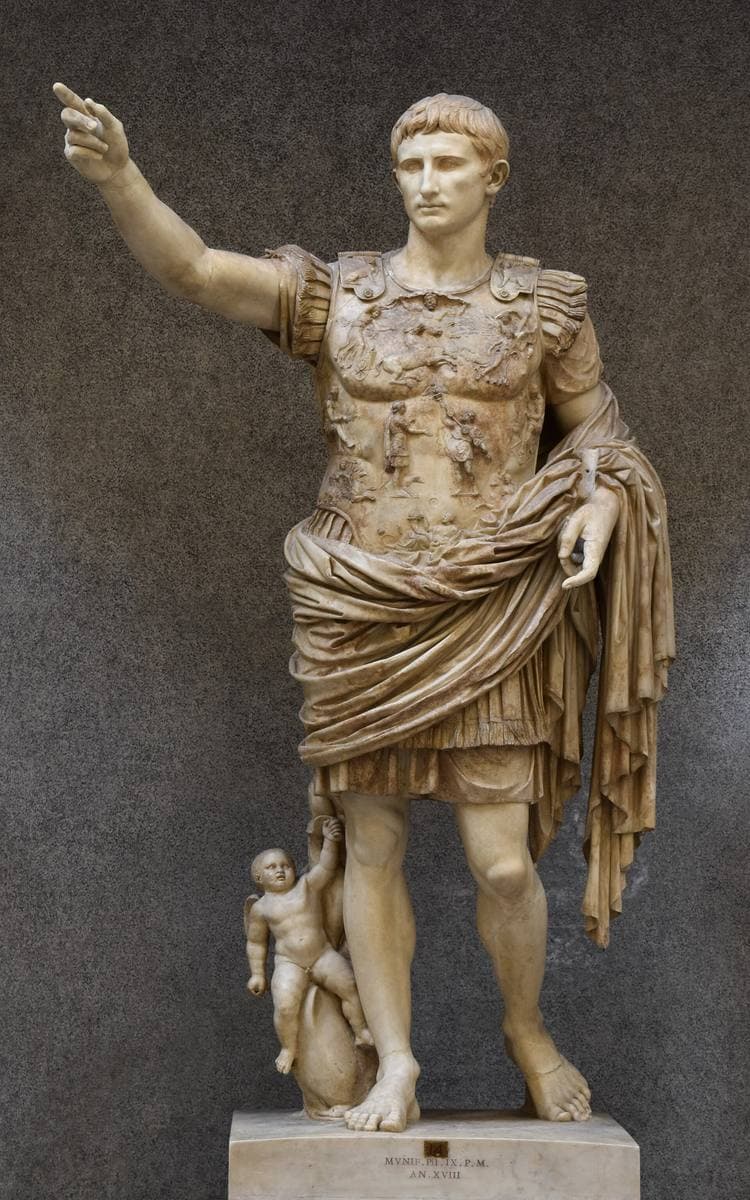 A marble statue of Augustus in armour with one arm raised