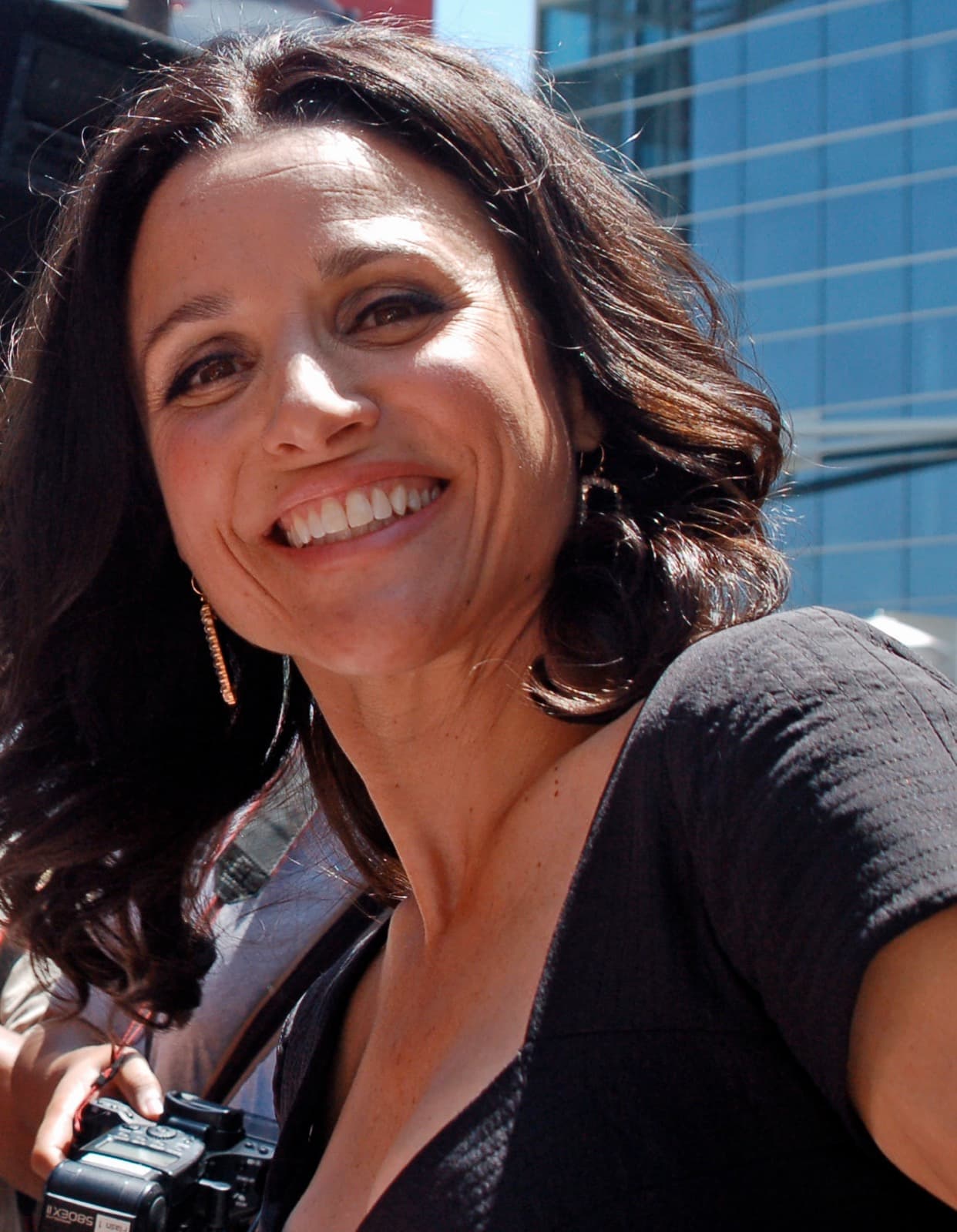 Julia Louis-Dreyfus smiling outdoors at her Walk of Fame ceremony