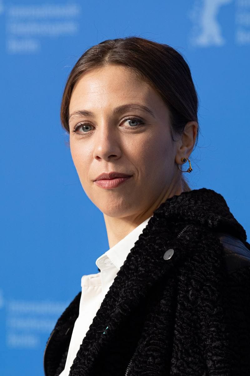 Barbara Chichiarelli, hair tied back, in a dark coat