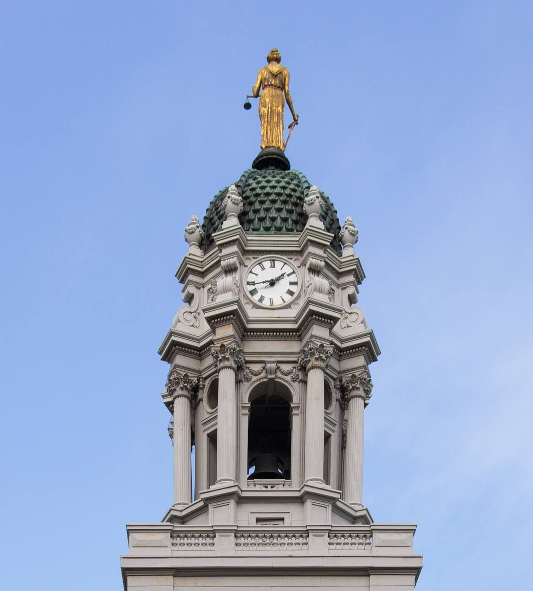 A white Greek Revival building with a domed cupola
