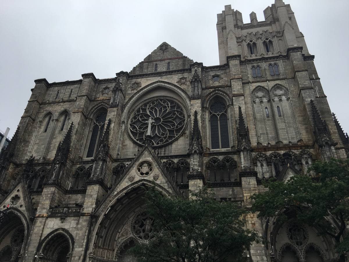 The pale stone Gothic front of a huge cathedral