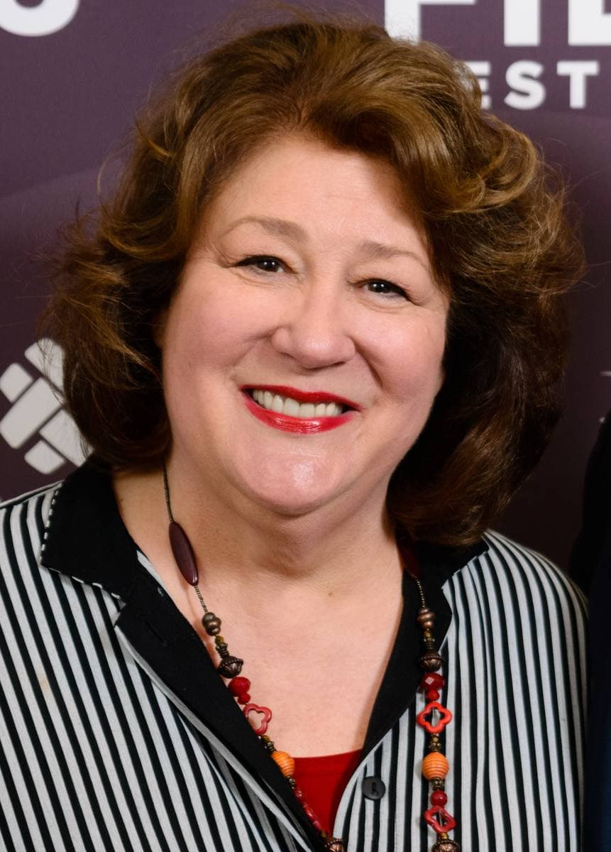 Margo Martindale smiling in a striped jacket