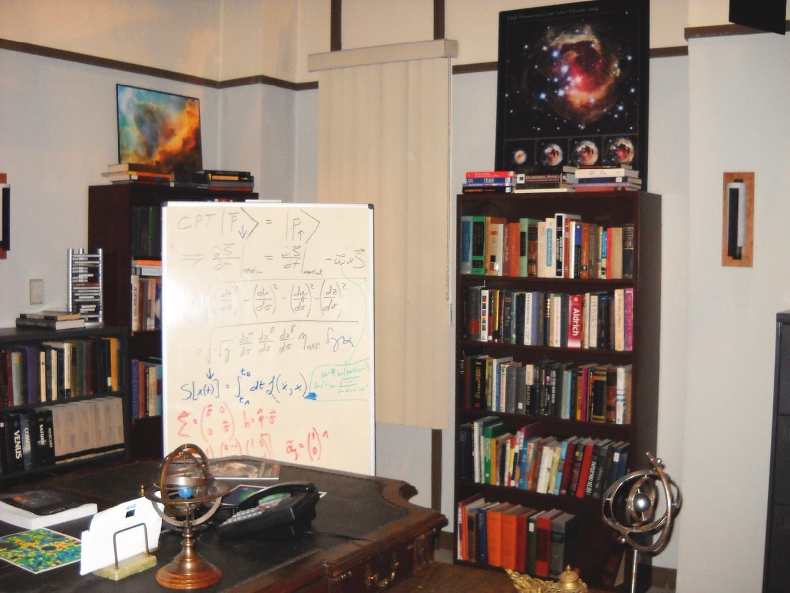 A study with a whiteboard covered in equations between two bookcases