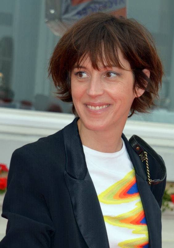 Florence Loiret Caille, short dark hair, smiling, in a dark jacket