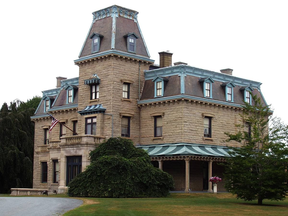 Chateau-sur-Mer, a dark granite mansion with a tall mansard roof and tower