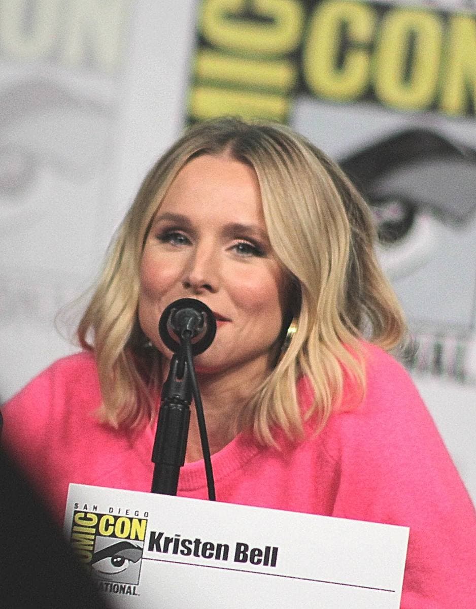 Kristen Bell speaking at a panel table