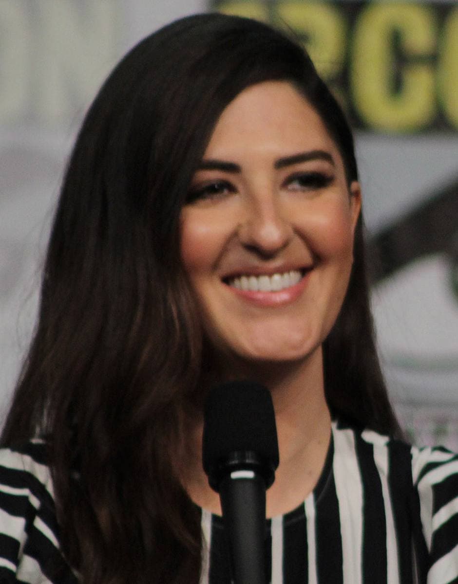 D’Arcy Carden smiling at a panel