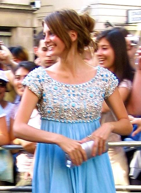 Mischa Barton in a pale blue embellished dress at a premiere, smiling