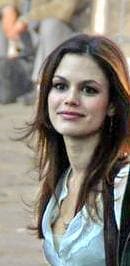 Rachel Bilson in a white shirt, looking towards the camera