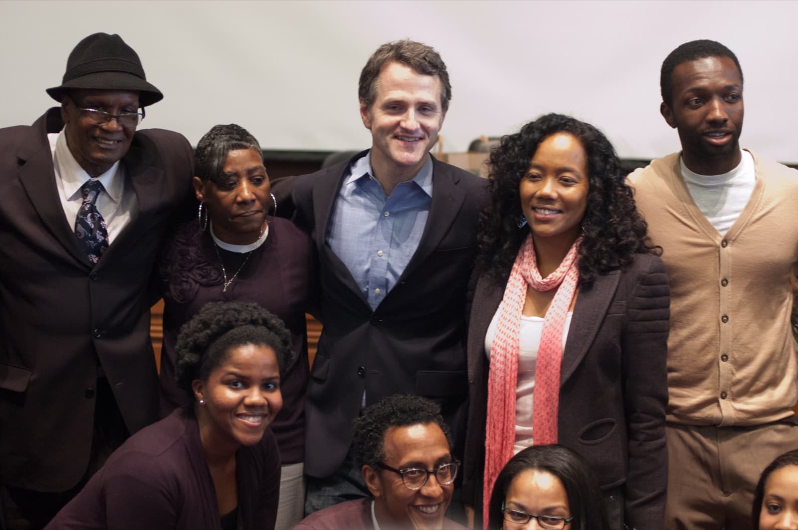 A line of Wire cast members standing together at a university event